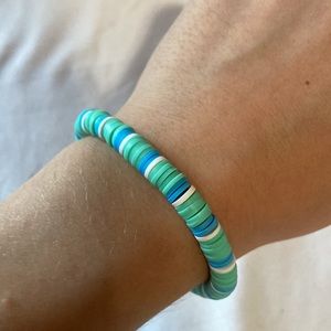 Teal, blue, and white clay beaded bracelet